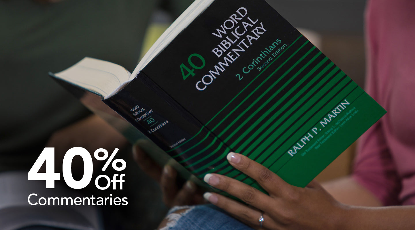 Person holding a book with promotional text for 40% off commentaries.