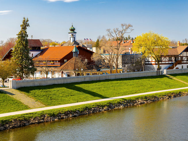 Townscape with houses along a riverbank on a sunny day