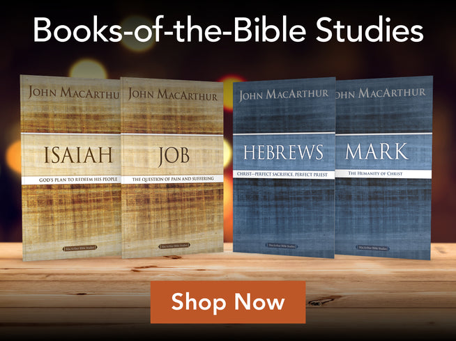 Four John MacArthur books displayed on a wooden surface against a warm blurred background, with the title 'Books-of-the-Bible Studies' at the top and an orange 'Shop Now' banner at the bottom.