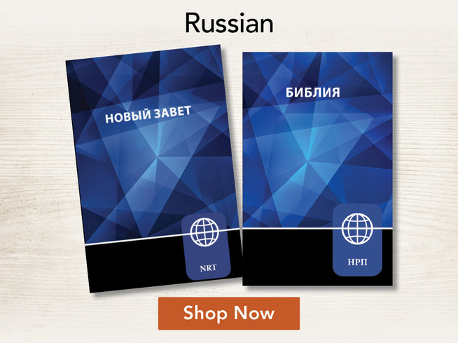 Two blue book covers with geometric designs on a light wooden surface, featuring text and branding.