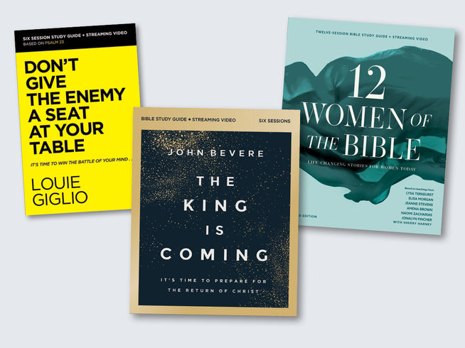 Three books on a light gray background with titles and authors visible.