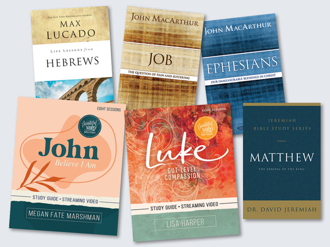 Collection of Bible study books on a light gray background