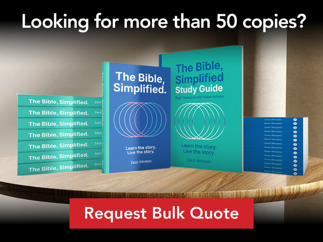 Multiple copies of 'The Bible, Simplified' on a wooden table with promotional text.