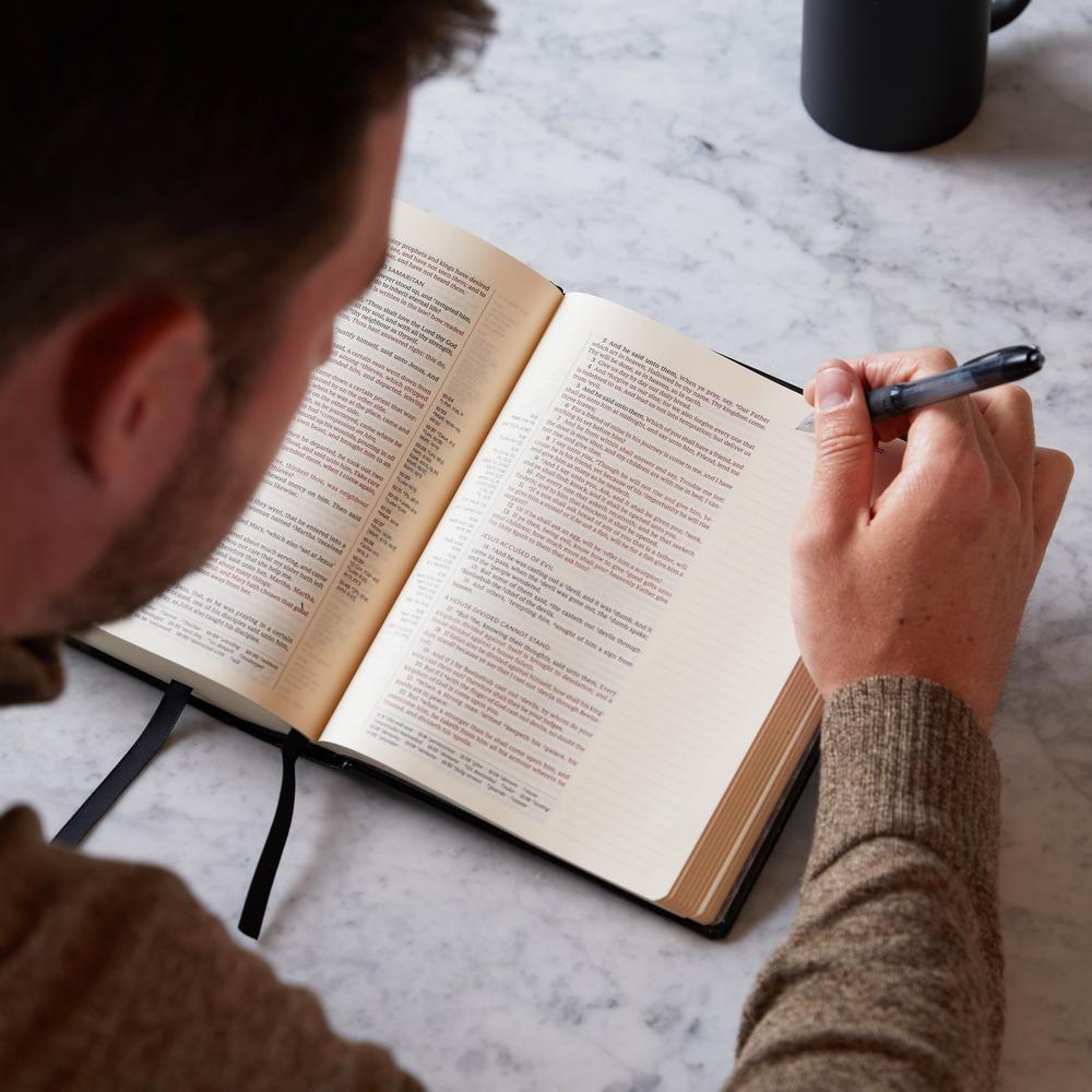 Premium Photo  Holy bible, notebook, glasses and pen on a desk